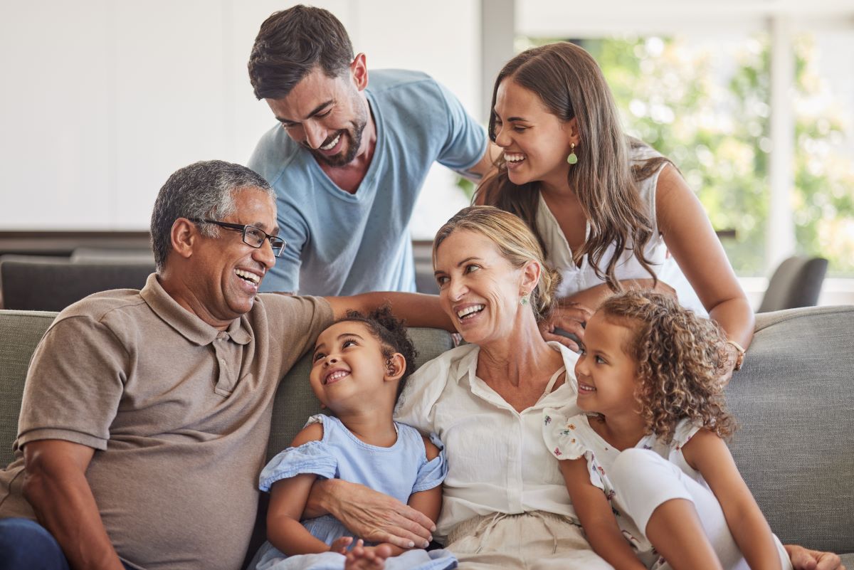 Intergenerational family sitting on a couch 